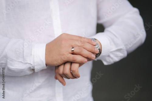 Close up of groom put hand on watch © Aleksandr