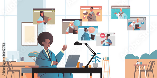 african american businessman chatting with colleagues during video call business people having online conference communication concept office interior horizontal portrait vector illustration