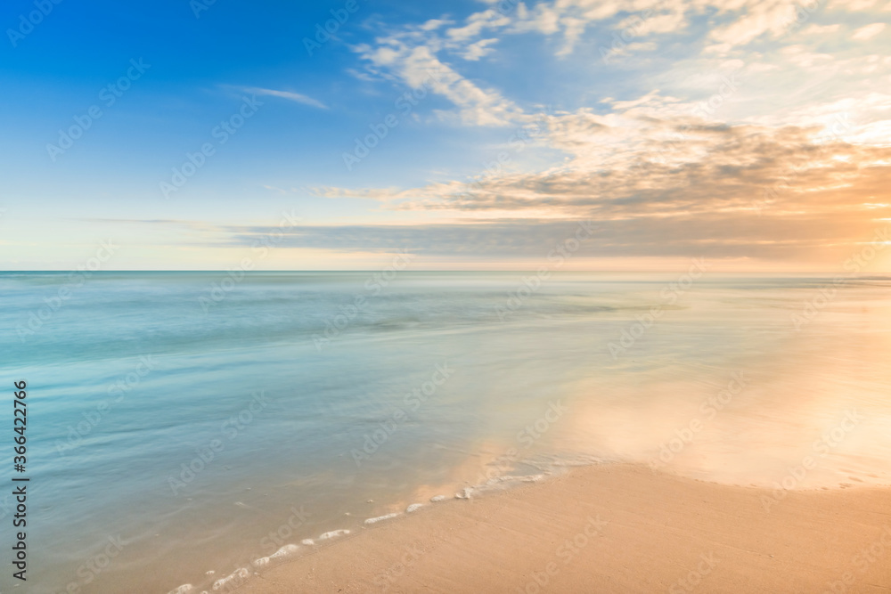 beautiful calmness sunset on the tropical beach in relaxing time