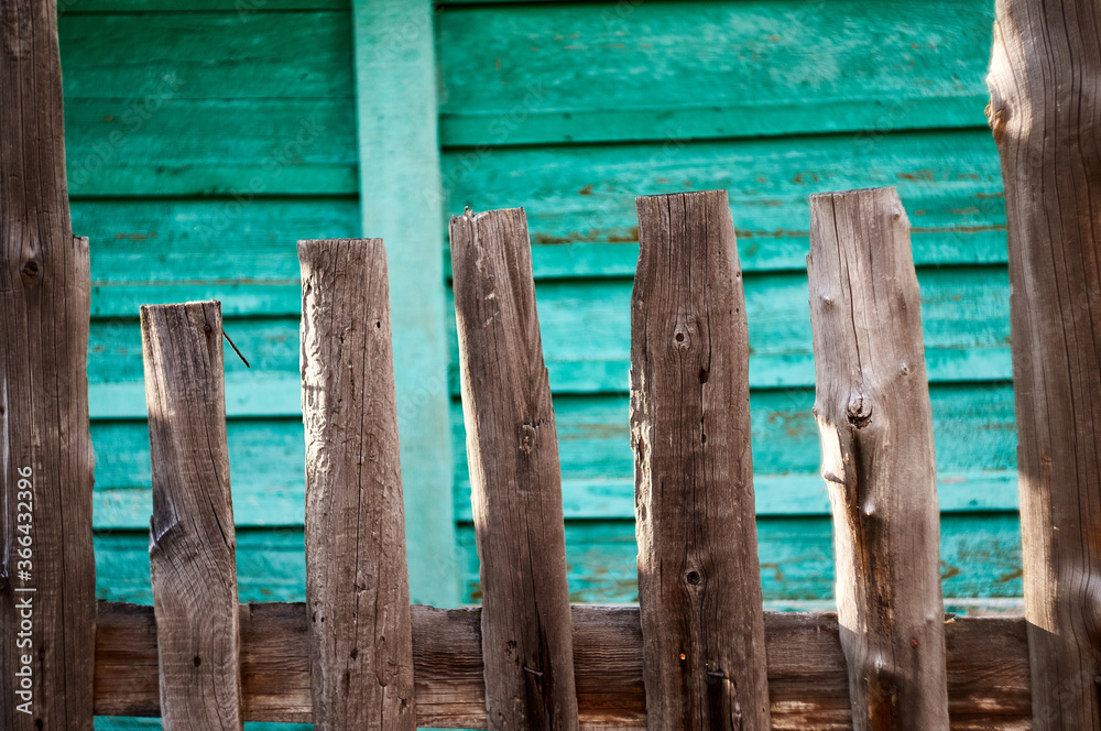 old wooden fence with a bright colored background old wooden fence with a bright colored background