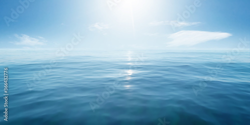 Closeup surface of calm ocean blue sea water with sunshine and clouds behind. Abstract Background Texture. © Sondem