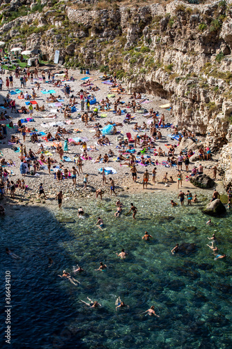  People relax and swimming on lovely beach Lama Monachile in Polignano a Mare, Adriatic Sea, Apulia, Bari province, Italy, © wjarek