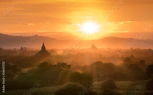 Pagoda landscape of Bagan in misty ,under a warm sunset in the plain of Bagan,Myanmar
