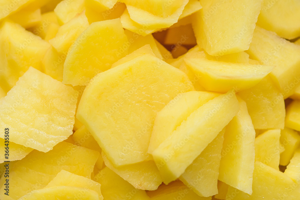 Big peeled new potatoes, yellow potatoes on a wooden board. Big peeled new potatoes, yellow potatoes on a wooden board.