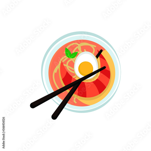 Laksa soup with noodles shrimps fish egg chopsticks spoon bamboo leaf traditional asian cuisine food dish