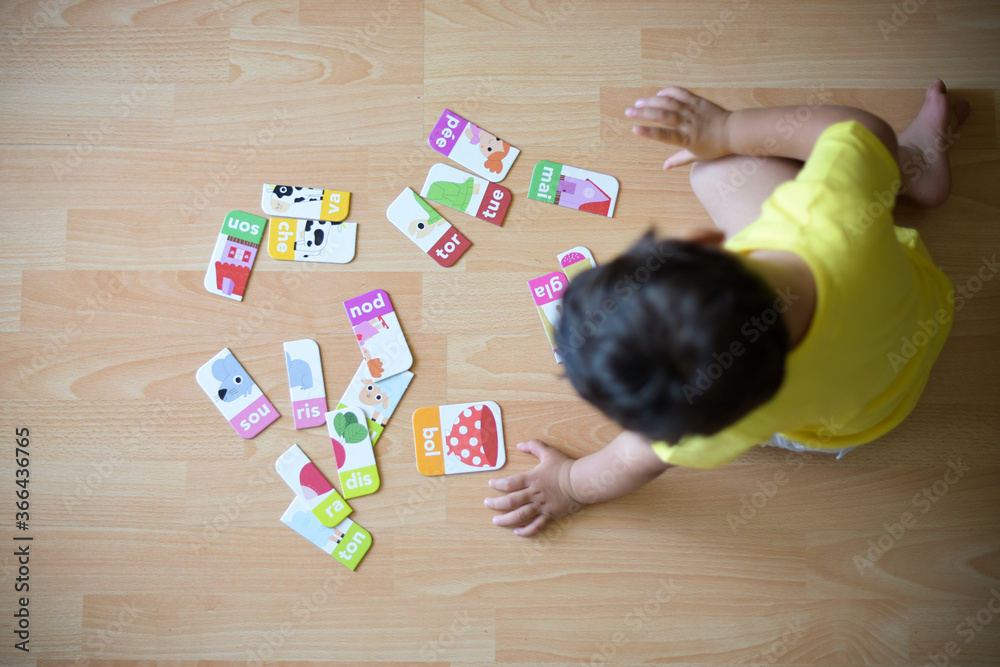 young boy playing at home with puzzle young boy playing at home with puzzle