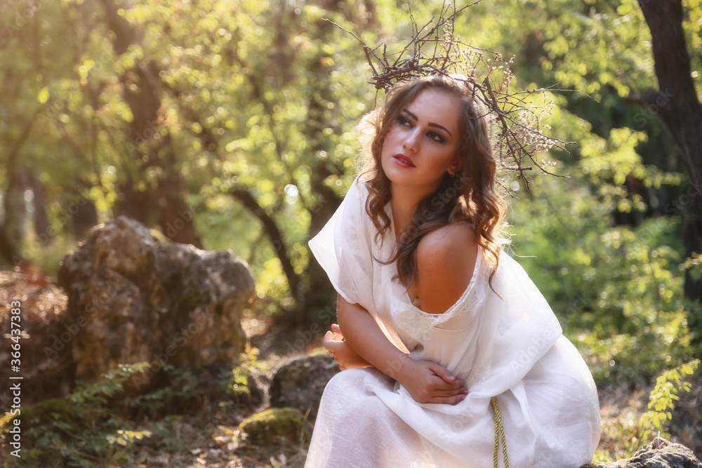 Beautiful mystery gothic woman in long white dress in autumn forest. Beautiful mystery gothic woman in long white dress in autumn forest.