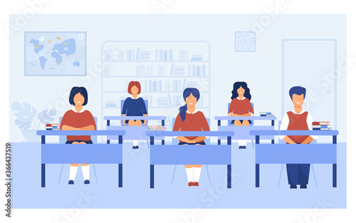 Intelligent pupils studying in classroom isolated flat vector illustration. Cartoon kids sitting at desks during school lesson or exam. Education and learning concept