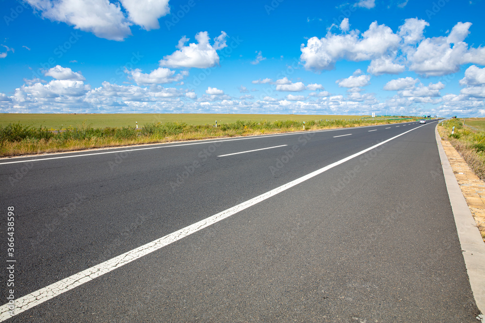 Empty highway, blue sky and white clouds landscape Empty highway, blue sky and white clouds landscape