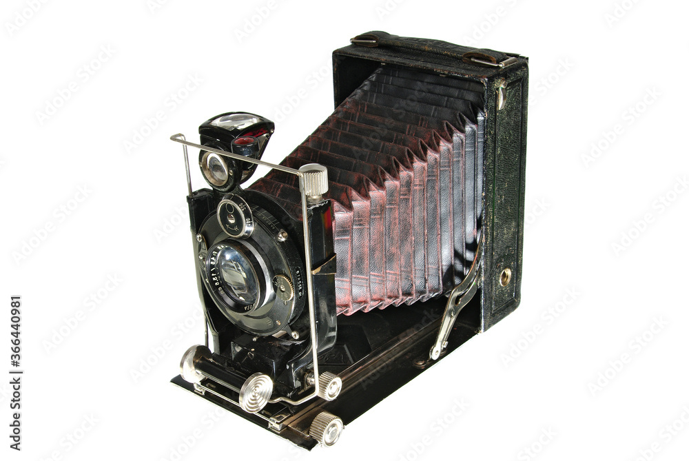 Fototapeta premium Foldable photo camera with leather fur. Isolated on white.