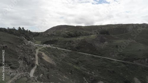 Capelulo Penmaenmawr Welsh mountain coastal valley aerial pan right view across north wales photo