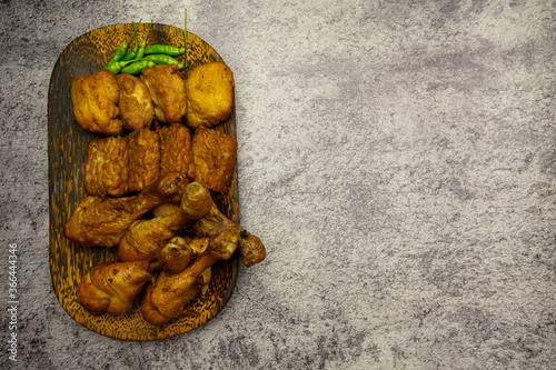 Bacem or baceman is a traditional dish from the Central Java, Indonesia, which has a sweet taste from palm sugar, isolated on gray background photo