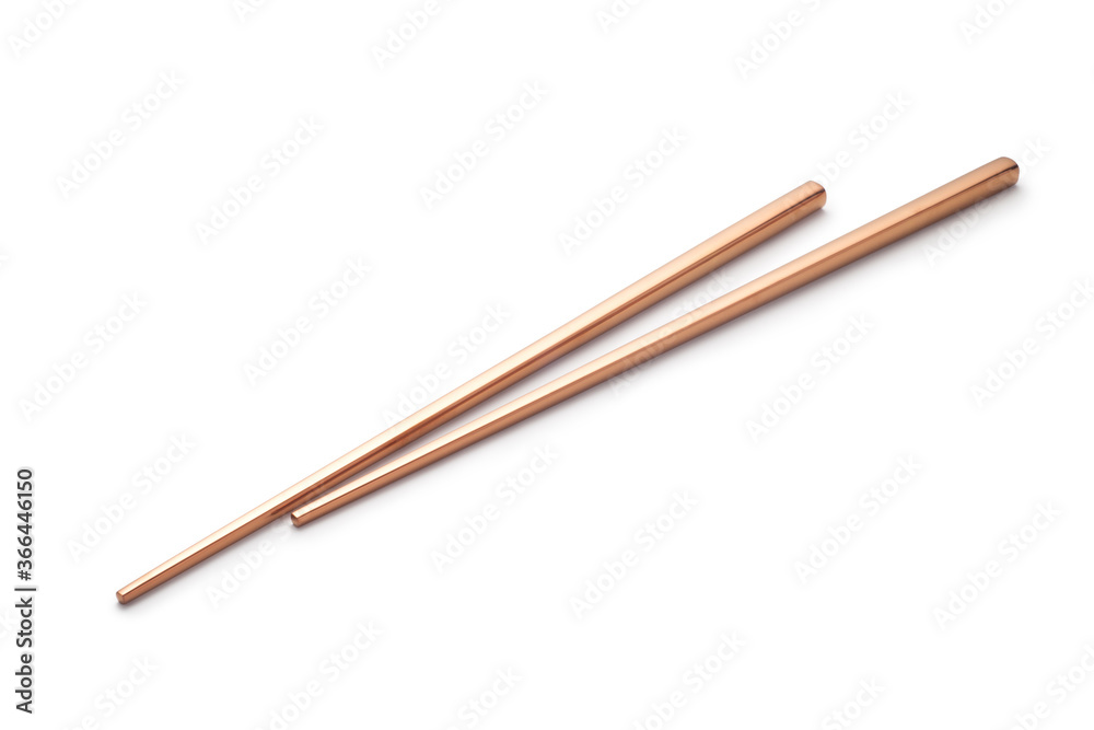 rose gold chopsticks isolated on white background.