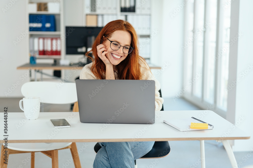Happy smiling young businesswoman working Happy smiling young businesswoman working