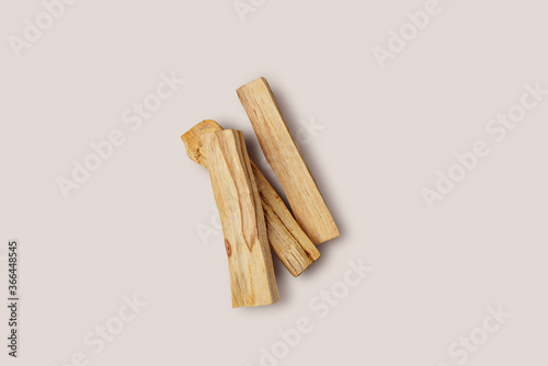 Scattered sticks of Palo Santo tree on a light background. Top view. Organic holy tree incense from Latin America. Color photo close-up of natural frankincense.