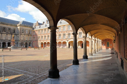 An alignment of columns in the Ridderzaal (Knight's Hall), which forms the center of the Binnenhof (13 century gothic castle), with the neo-gothic fountain (1883) on the left, The Hague, Netherlands