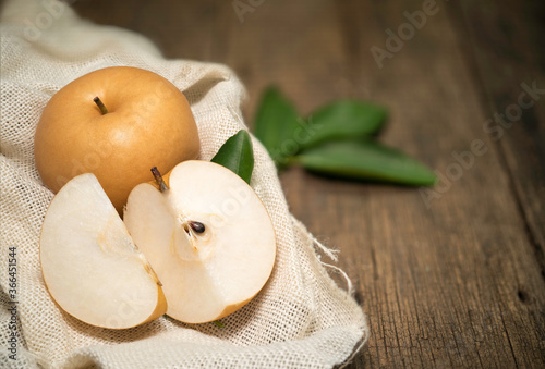 Korean pear or Snow pear on a wooden background, Nashi pear fruits delicious and sweet photo