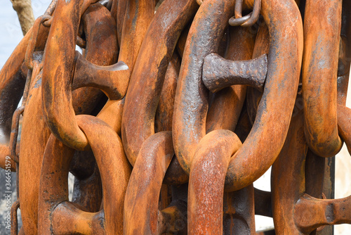 rusty links of heavy industrial chain photo