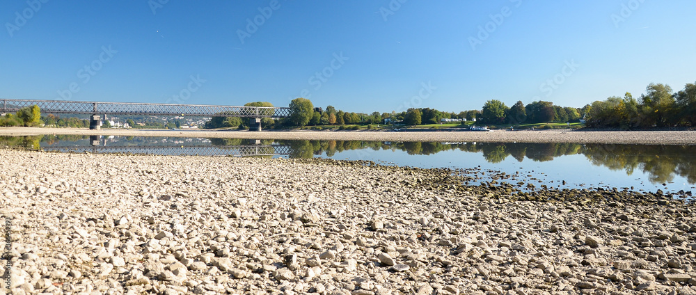 Dry riverbed on a hot summer day, in western Germany, visible floating barge.