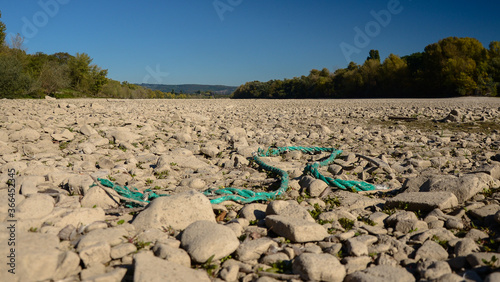 Dry riverbed on a hot summer day, in western Germany, visible floating barge.