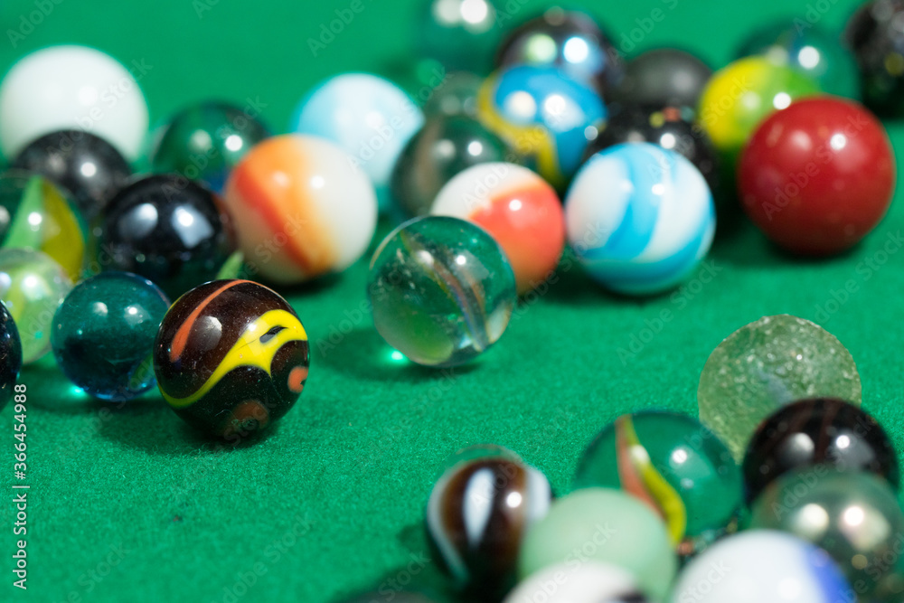 Colorful Marble Balls on Green background. Abstract Pattern Colorful Marble Balls on Green background. Abstract Pattern