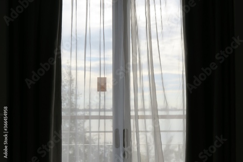 Back lighting of balcony window and curtain