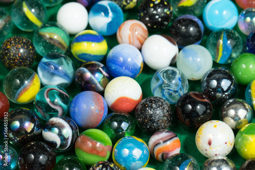 Colorful Marble Balls on Green background. Abstract Pattern