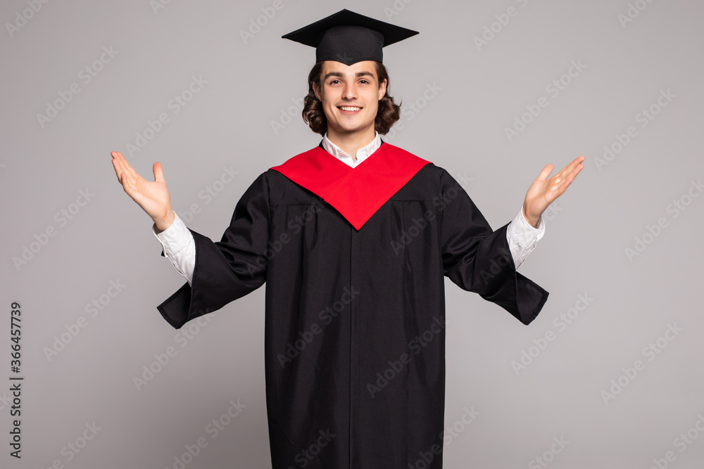 Young handsome graduated man with long hair over isolated background crazy and mad shouting and yelling with aggressive expression and arms raised. Young handsome graduated man with long hair over isolated background crazy and mad shouting and yelling with aggressive expression and arms raised.