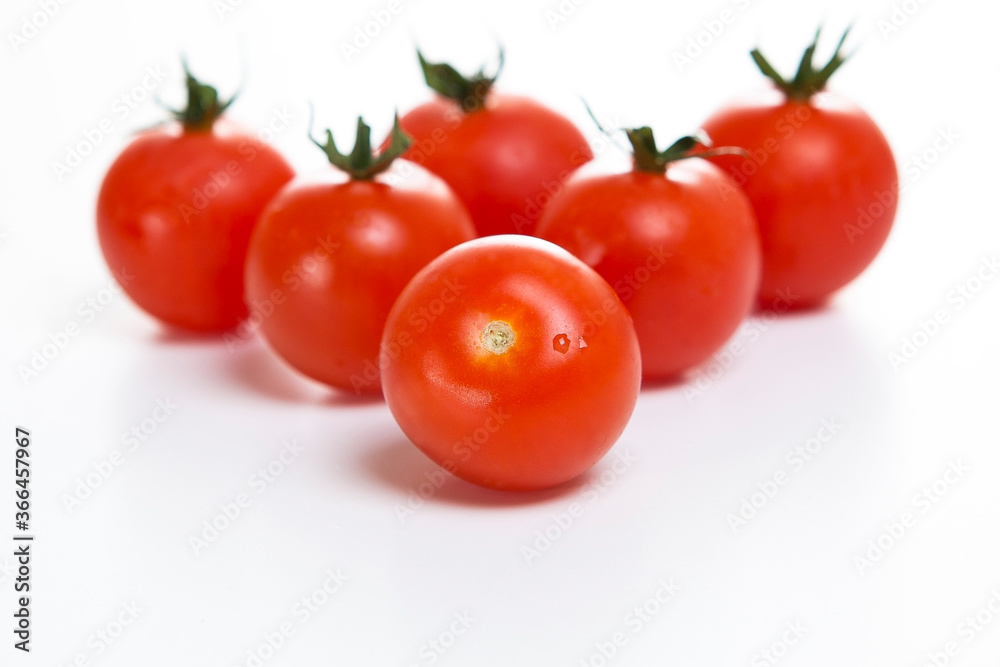 fresh cherry tomatoes on a white background fresh cherry tomatoes on a white background