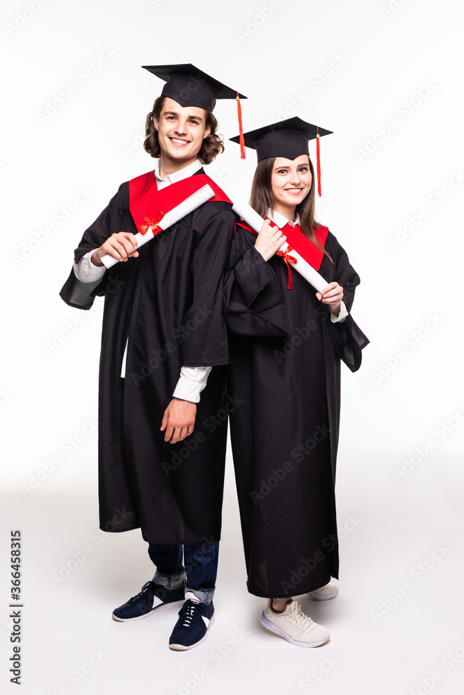 Full length portrait of a young couple posing with their diplomas isolated on white background Full length portrait of a young couple posing with their diplomas isolated on white background
