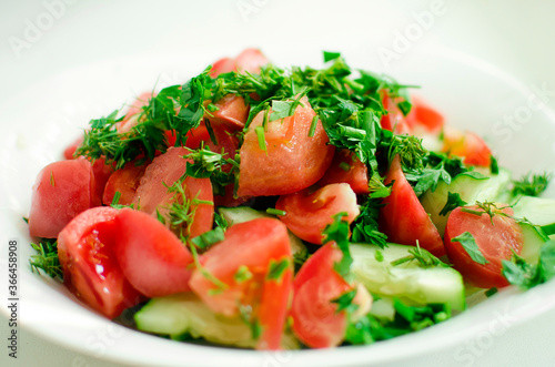 Tomato salad with cucumber. Healthy food concept.