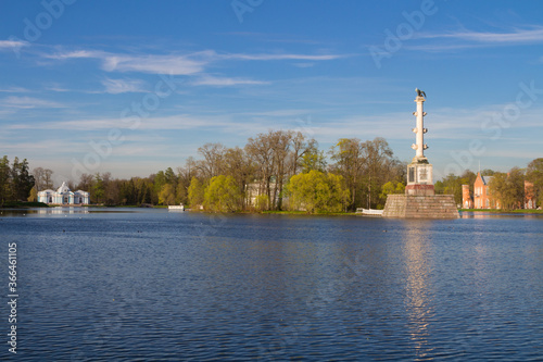 View of the Chesma column of Catherine Park, standing in a Large lake and the Hermitage pavilion. photo