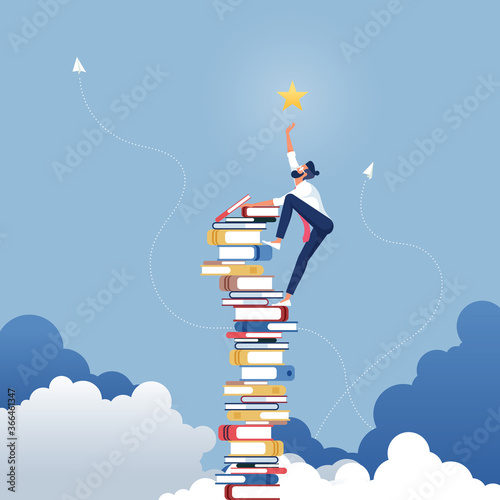 Businessman reach out for the stars by using books as the platform-Describe reach successful in business photo