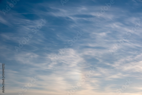 Fototapeta Naklejka Na Ścianę i Meble -  Blue sky with white pinnate clouds and rainbow.