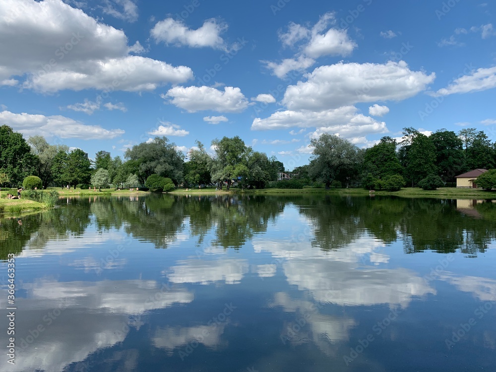 Clouds reflection in the lake water, natural colors, lake background Clouds reflection in the lake water, natural colors, lake background