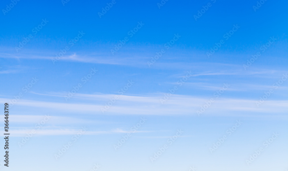 Blue sky with windy cirrus clouds at daytime Blue sky with windy cirrus clouds at daytime