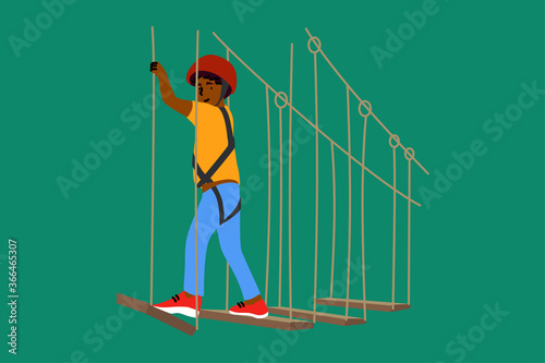 Sport, game, adventure, childhood, recreation concept. Young happy excited african american boy child kid climbing on high rope trail in amusement center. Extreme leisure in forest playground park.