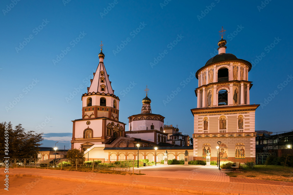 Russia, Irkutsk - June 30, 2020: The Cathedral of the Epiphany of the Lord. Orthodox Church, Catholic Church in sunset with paving