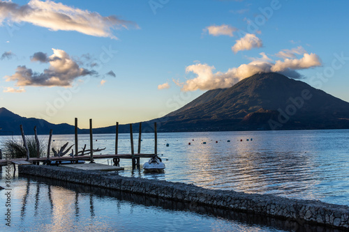 Morning view of the Atitlan volcano over the Atitlan lake in Panajachel with docks in the foreground © Thibaud