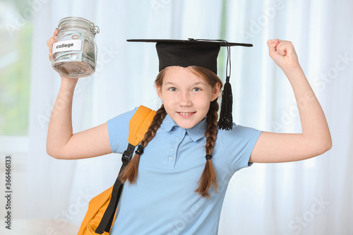 Happy girl with savings for...