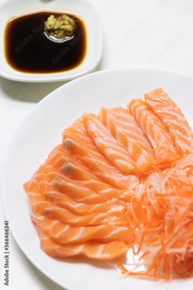 Fresh salmon sashimi serve on plate. Japanese food style. Fresh salmon sashimi serve on plate. Japanese food style.