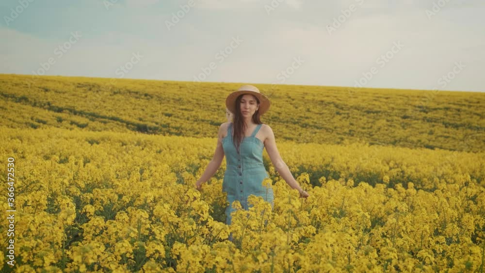 beautiful woman farmer enjoys rape crop, beauty spring yellow blooming field beautiful woman farmer enjoys rape crop, beauty spring yellow blooming field