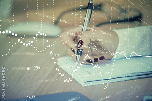 Multi exposure of woman's writing hand on background with data technology hud. Concept of innovation.