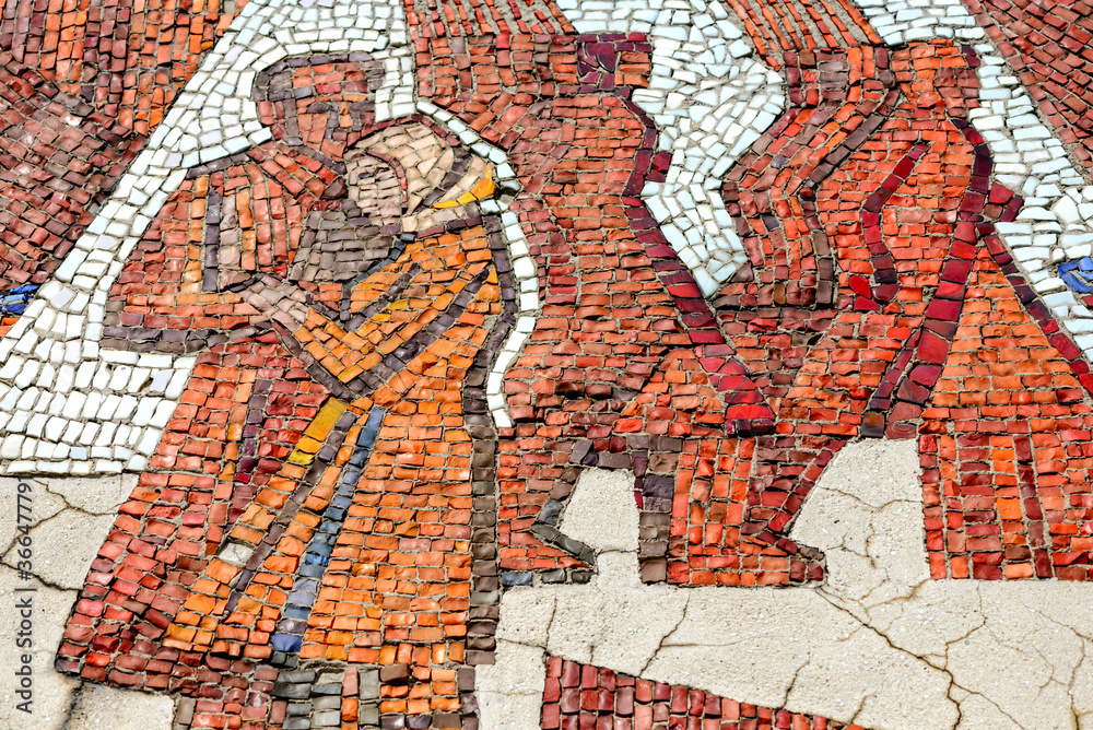 Obraz premium Multicolored mosaic panel of red-orange smalt, elements of the old Soviet monument