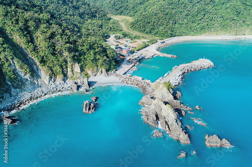 Fenniaolin Fish Harbor Aerial View - Blue seawater with morning bright sunlight, birds eye view use the drone, shot in Suao Township, Yilan, Taiwan. photo