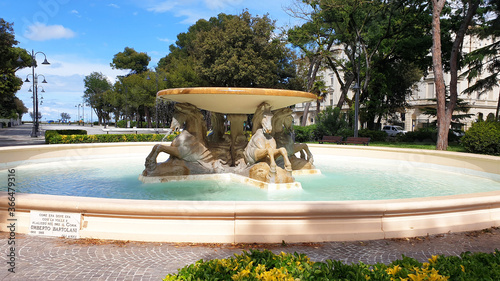 Fountain four horses in the park Federico Fellini in Rimini. Panorama.