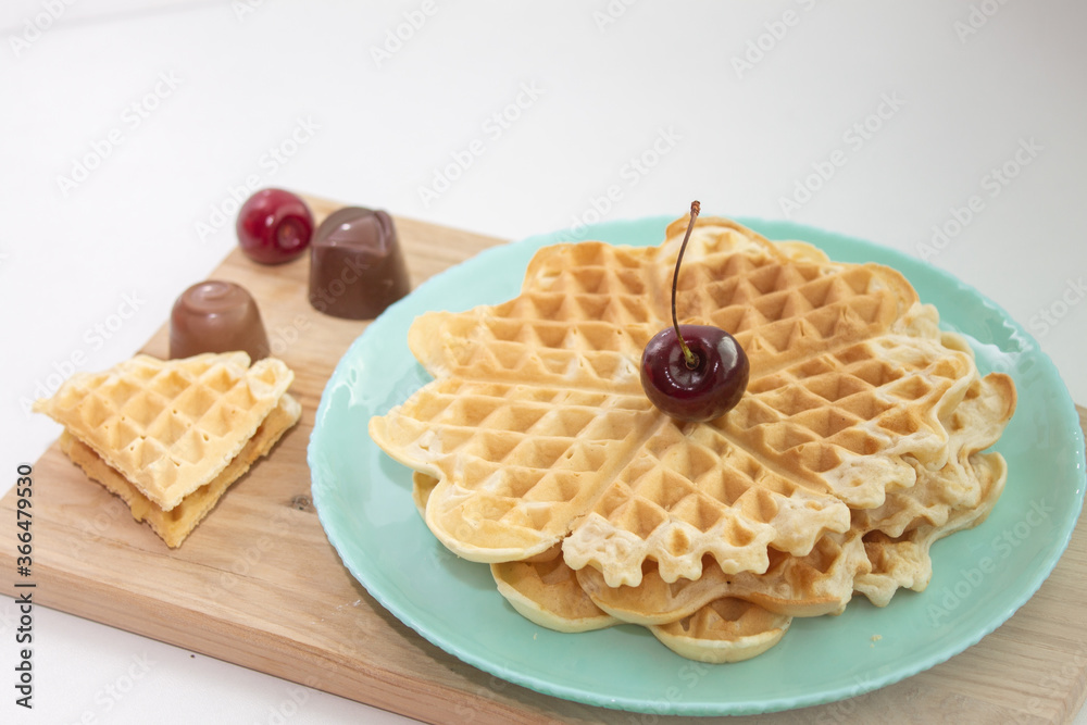 Belgian waffles with cherries and chocolates Belgian waffles with cherries and chocolates