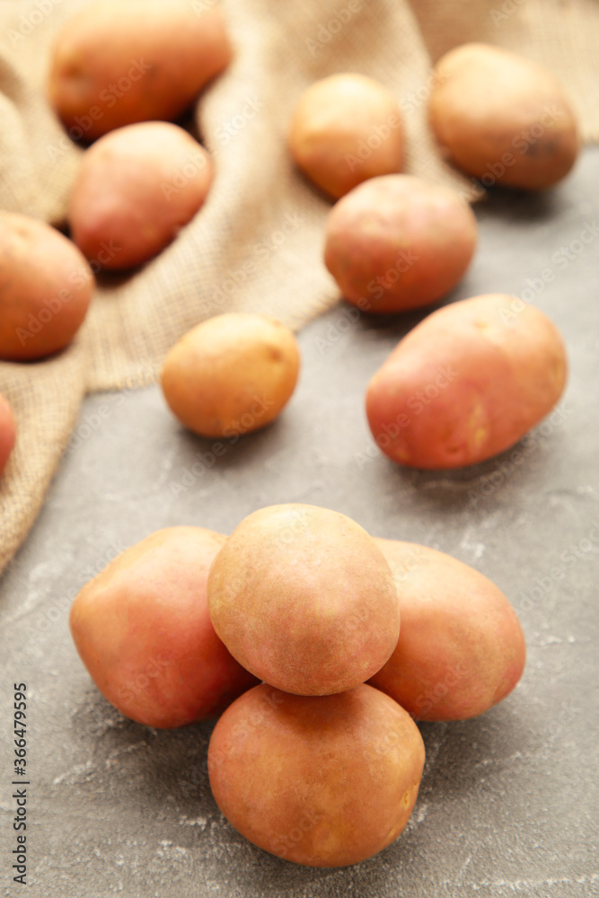 Potatoes on grey concrete background, top view Potatoes on grey concrete background, top view