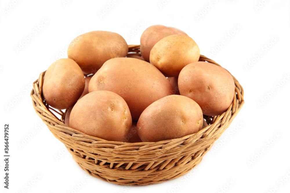 Basket of fresh tasty new potatoes isolated on white background Basket of fresh tasty new potatoes isolated on white background