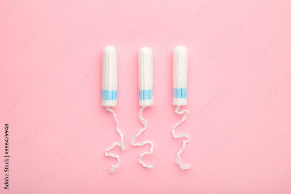 Menstrual tampons on a pink background. Cotton tampon for women
